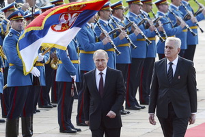 Russia's President Putin and his Serbian counterpart Nikolic walk in front of a honour guard in Belgrade