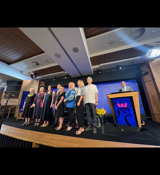 Members of the Ukrainian community in Canberra sing the Ukrainian national anthem